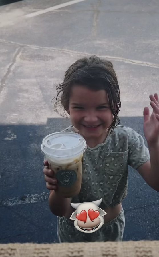 Young customer smiling with a Double H Coffee Co. drink